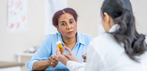 female-doctor-explaining-a-prescription-medication-to-a-female-patient